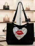 Bolso tote negro corazón plateado champán con lentejuelas reversibles y labios rojos | vaqueraspain