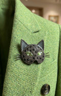 Broche cabeza de gato con ojos verdes