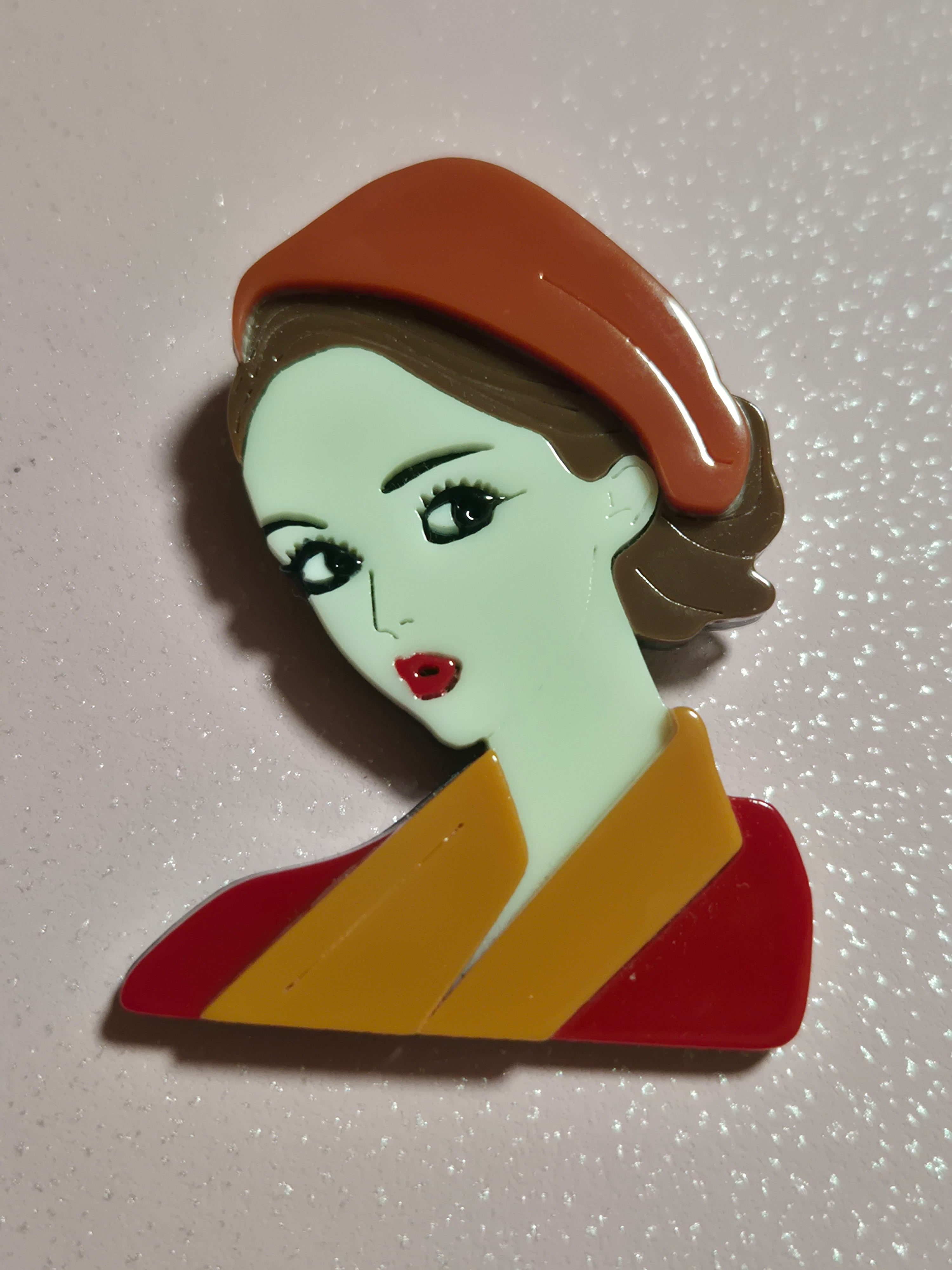 Broche vintage mujer castaña con boina