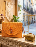 Bolso boho chic luminoso color naranja melocotón