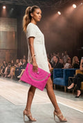 Bolso boho chic rosa fucsia vibrante con flecos